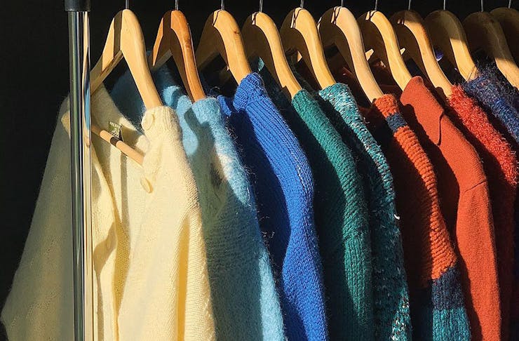 A line of cosy knits on a rail in an image from Fruit Bowl Vintage's Instagram account.