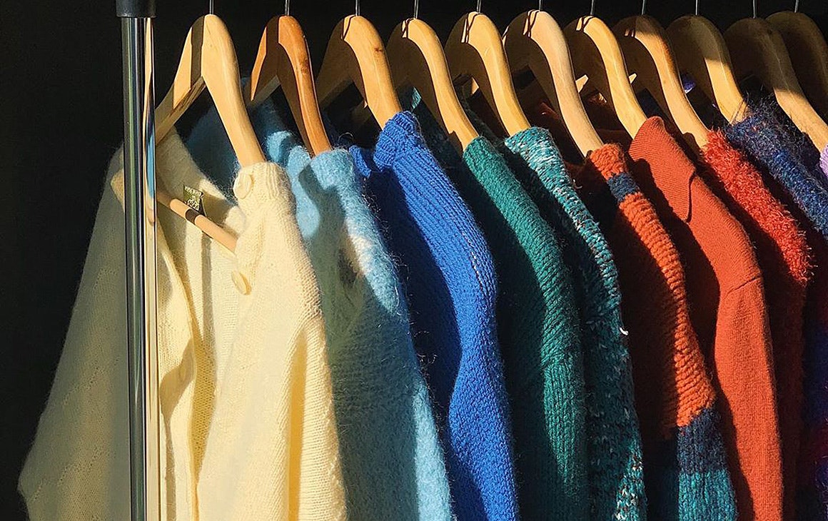 A line of cosy knits on a rail in an image from Fruit Bowl Vintage's Instagram account.