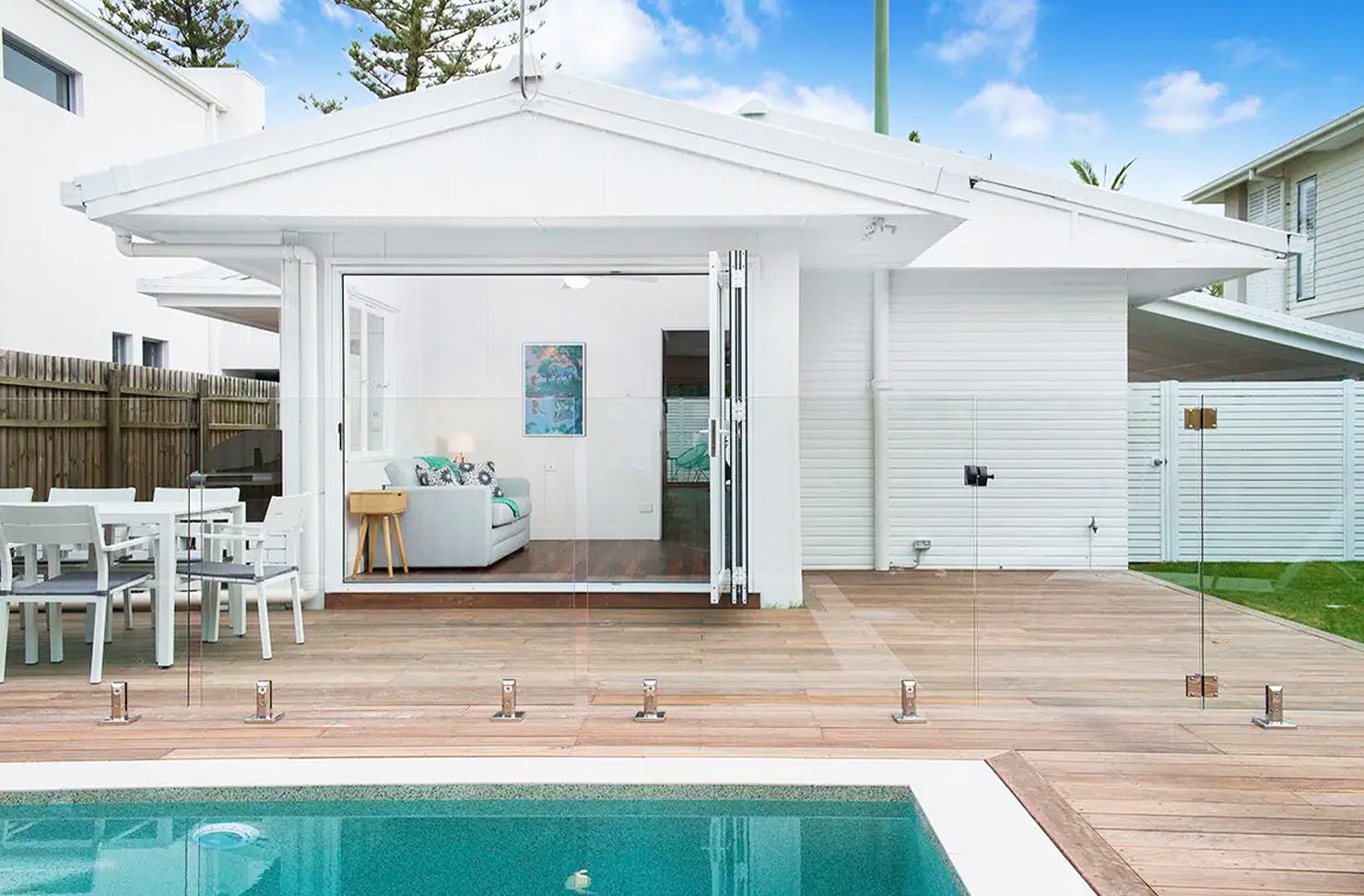 a white poolfront house