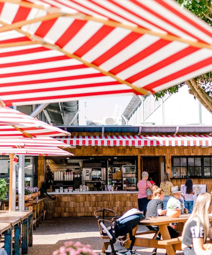 striped umbrellas at custard canteen cafe