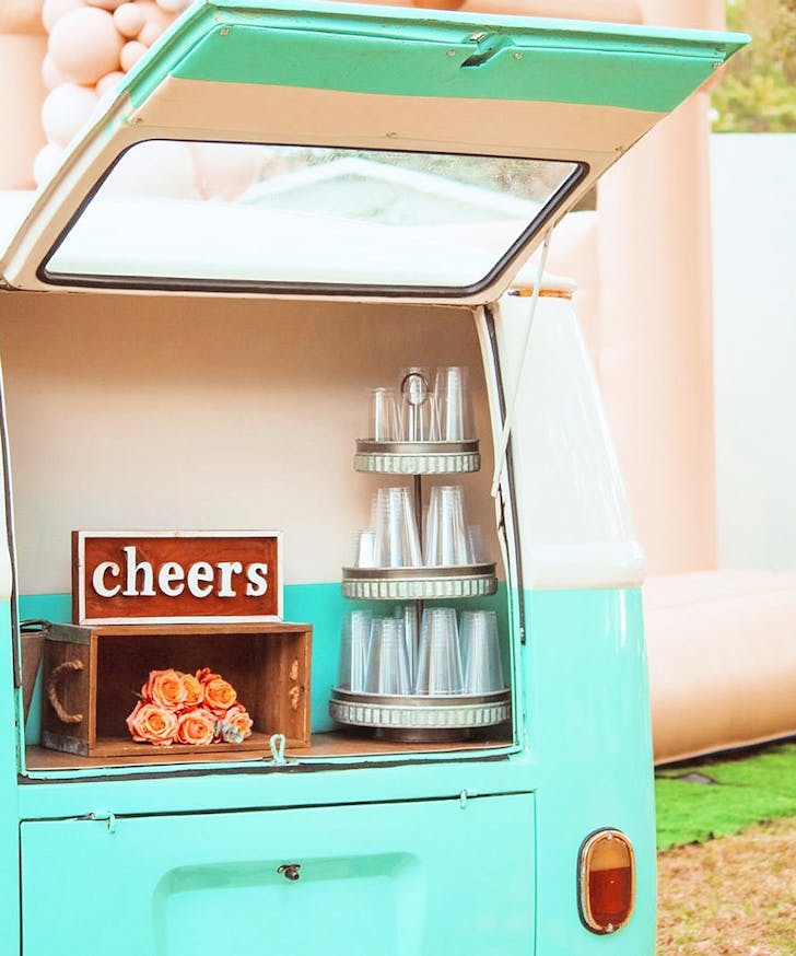 a green kombi van serving drinks