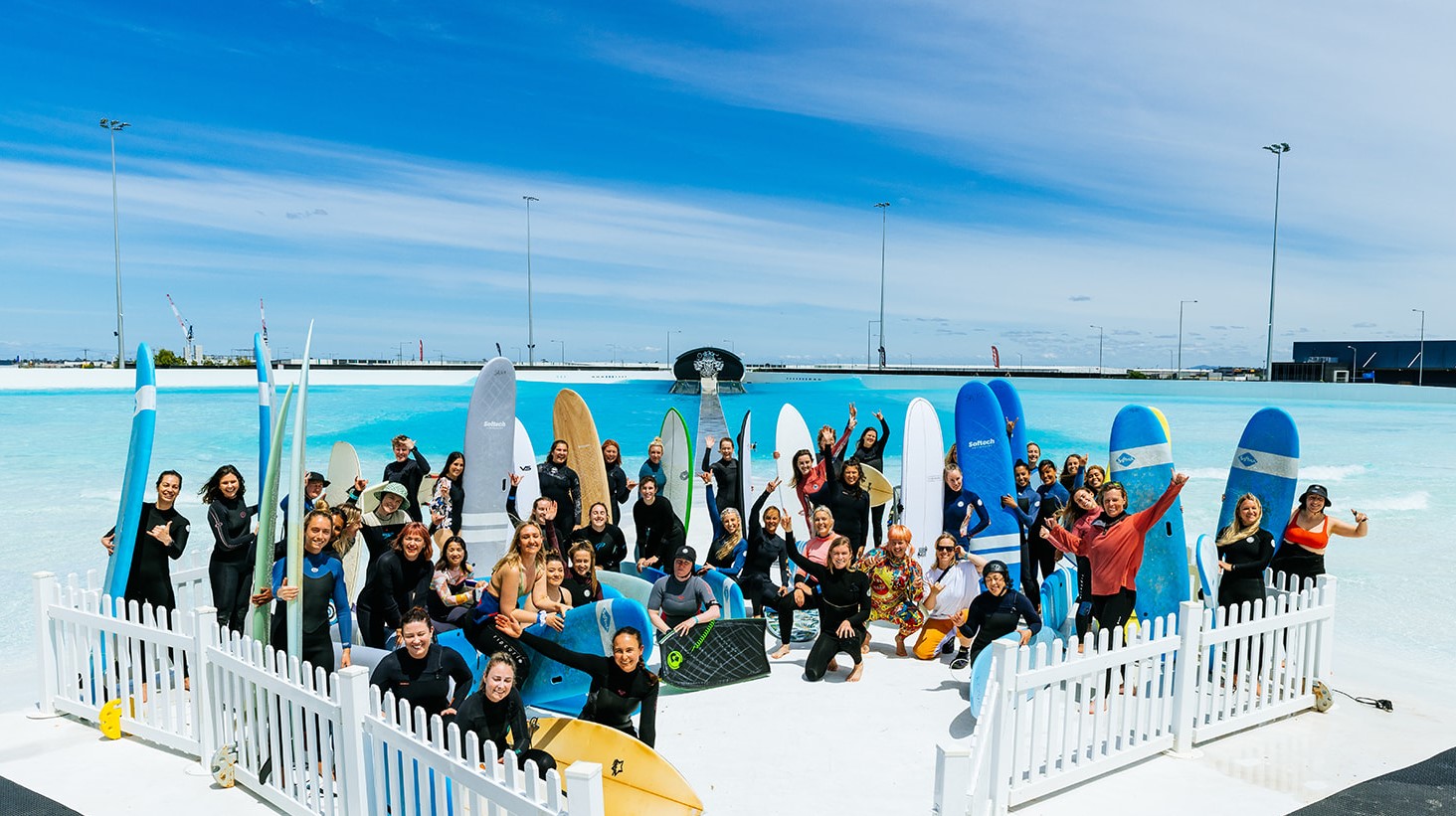 Group of people with surf boards.