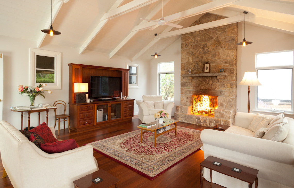 Lounge room of the grange cottage with fireplace