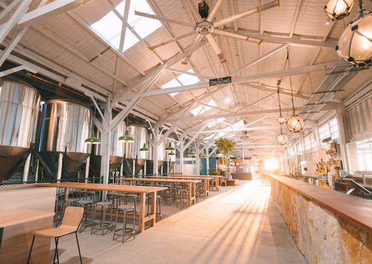 Inside the massive new Gage Roads Freo brewery with sun streaming in across the bar and dining area