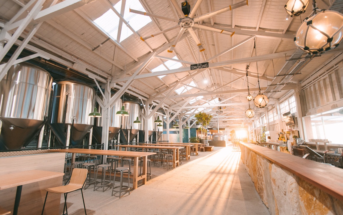 Inside the massive new Gage Roads Freo brewery with sun streaming in across the bar and dining area