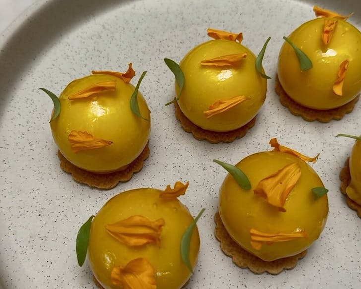 Gorgeous golden spheres studded with flower petals. 