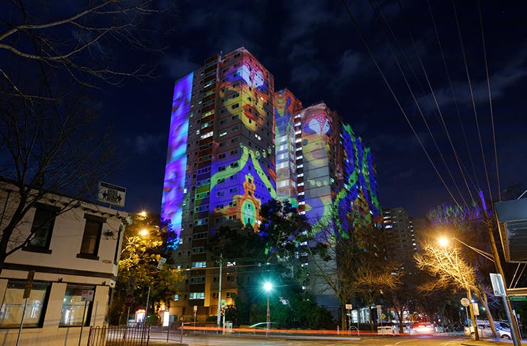 A large building in Fitzroy lit up with projection for the Gertrude Street Projection Festival.