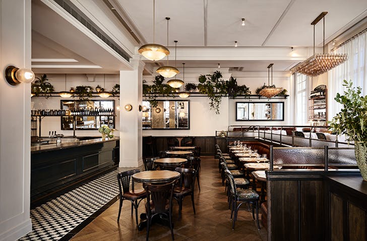 A high-ceiling restaurant with white walls at one of the premier private dining rooms Melbourne.