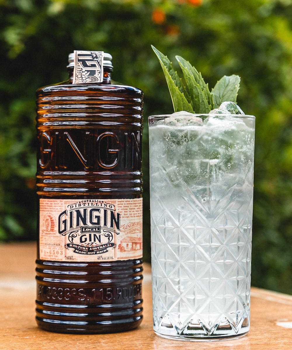 Bottle of Gingin Gin next to tall glass