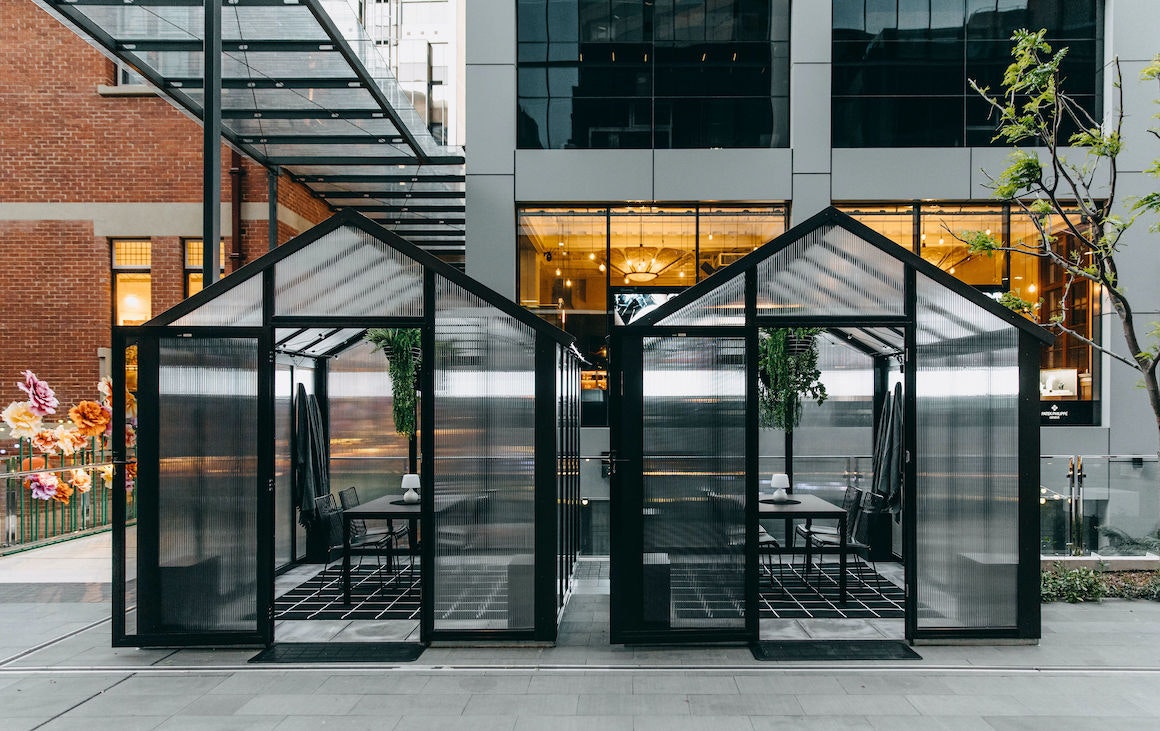 Two glasshouse dining pods outside the Heritage at Brookfield Place