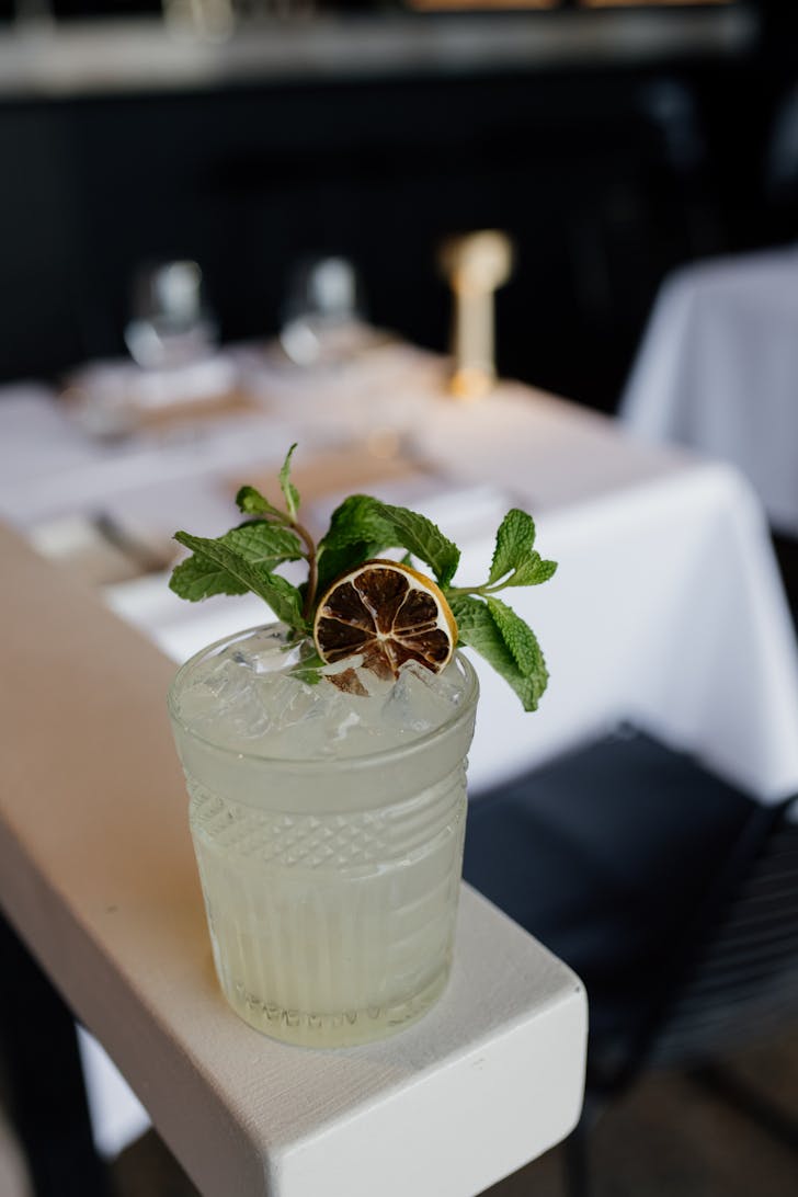 a cocktail on a white ledge