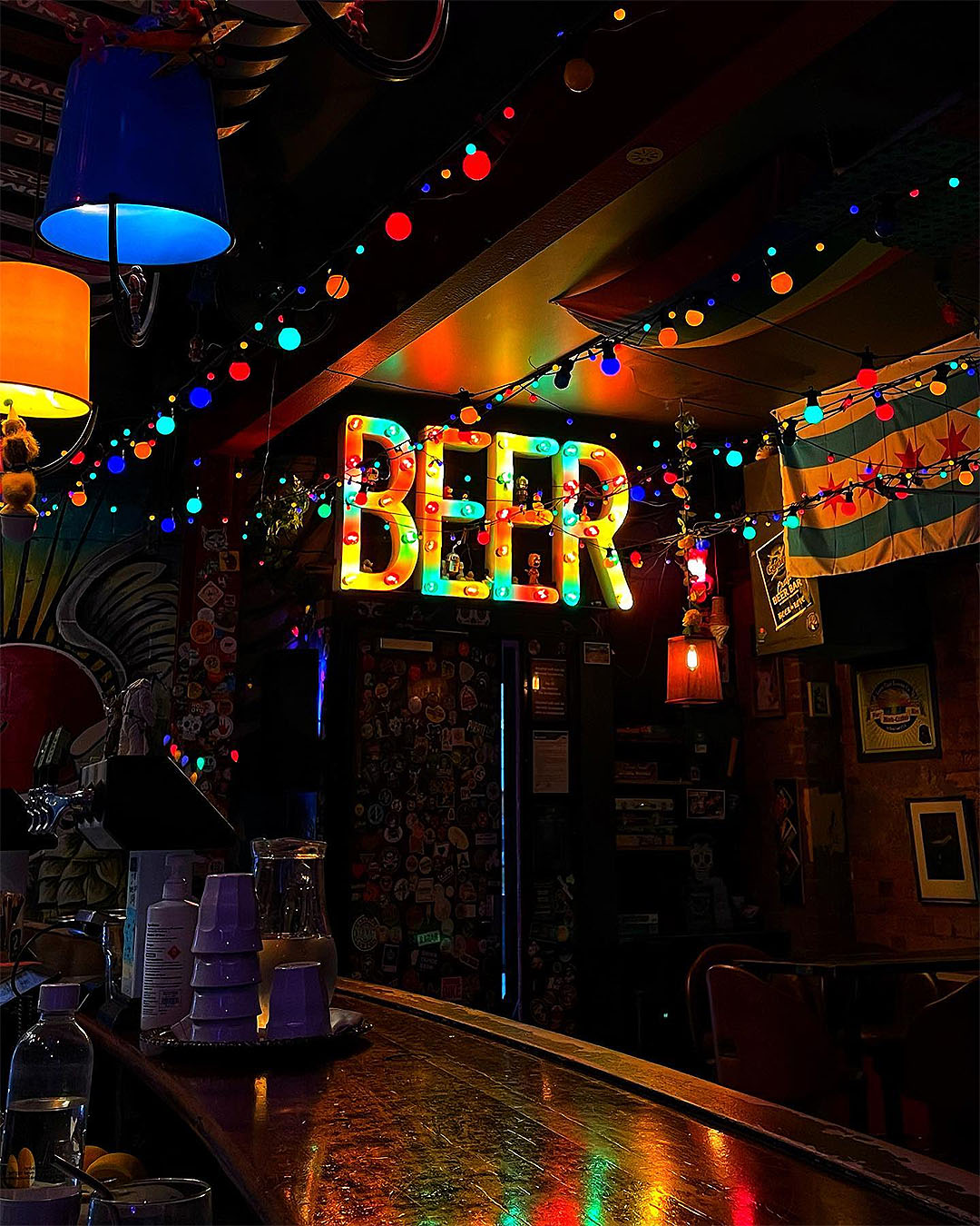 Inside Golding's Free Dive shows a sign illuminated that reads BEER.