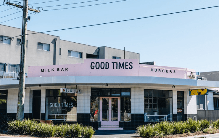 A corner milk bar with a pink roof.