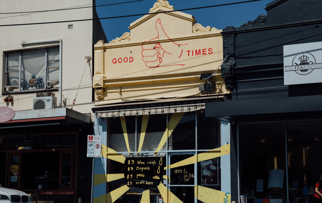 A shopfront with a colour yellow-painted menu, a best cheap restaurant Melbourne.