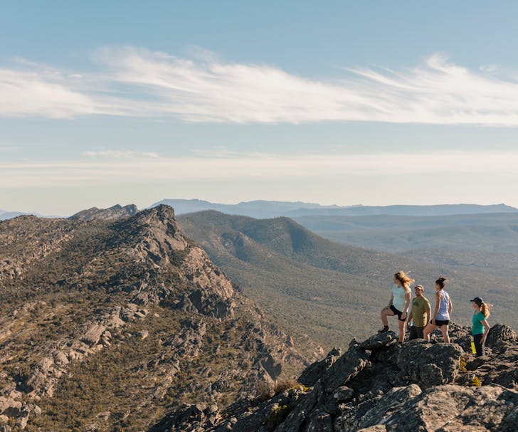 A group of people summiting one of the best hikes in Victoria. 