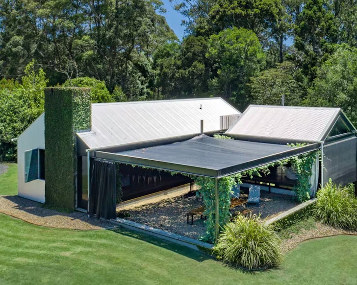 The vine covered atrium of the Grand Designs home one of the best Airbnbs for large groups near Brisbane