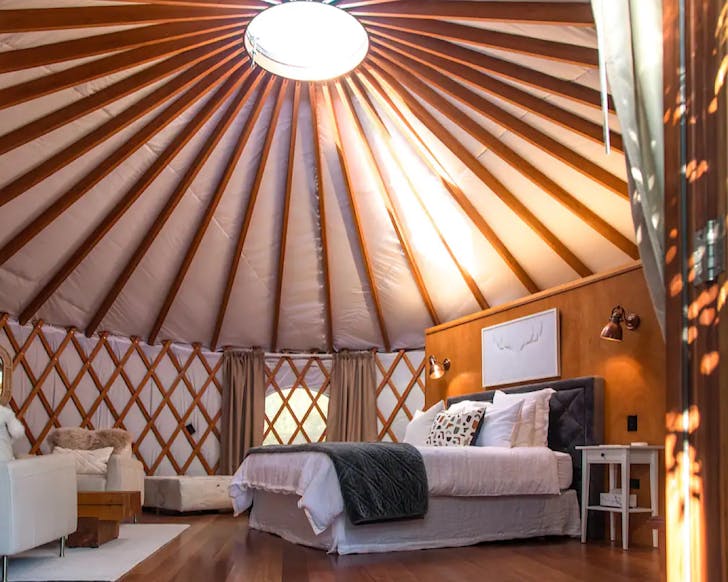 The interior of a boujee yurt, one of the best luxe, weird and wonderful accommodations in New Zealand. 