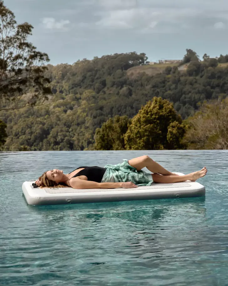 A woman at the pool at Gwinganna Retreat and Spa one of the best health and wellness retreats Australia