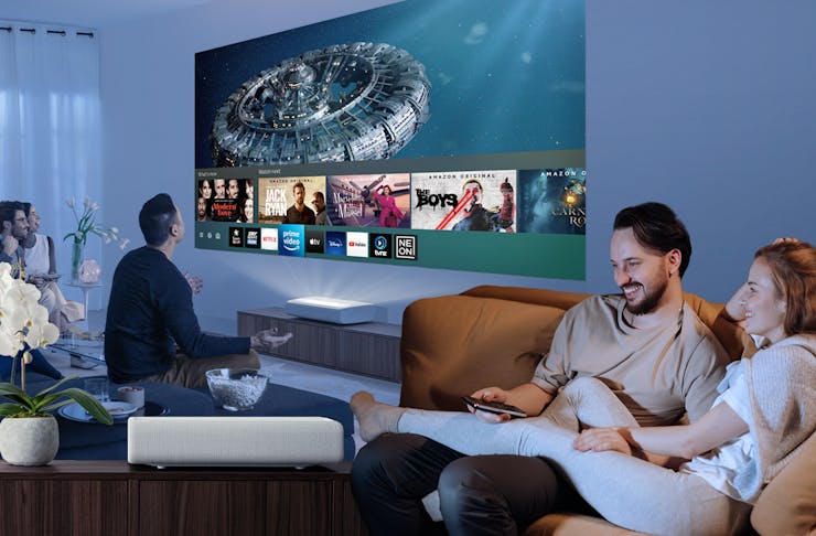 A Collage of friends enjoying a movie night, a couple and Samsung's The Premiere 4K Laser Projector