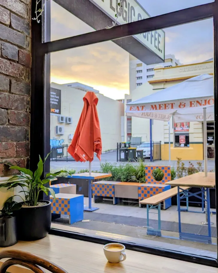 Cup of coffee in window of a cafe