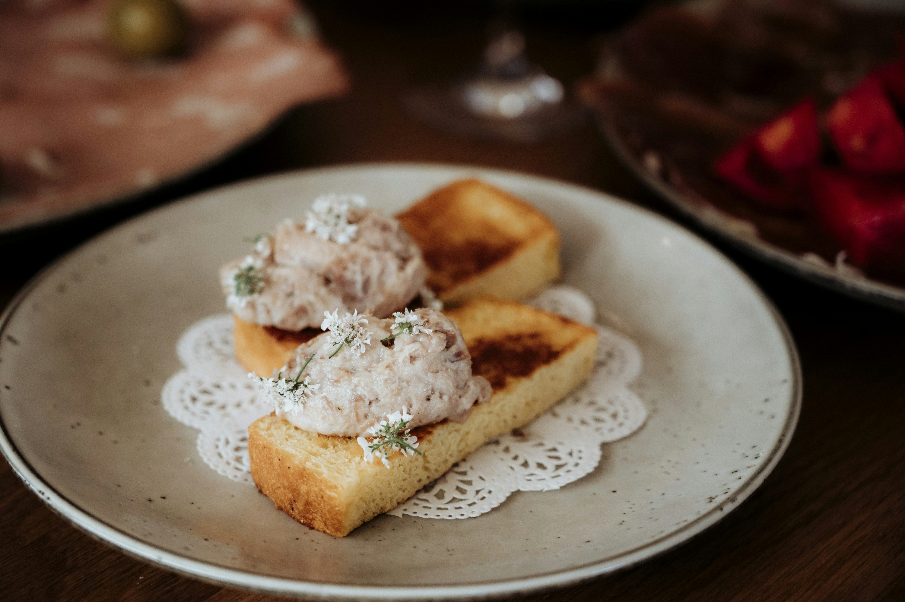 a close-up of two appetizers on a plate