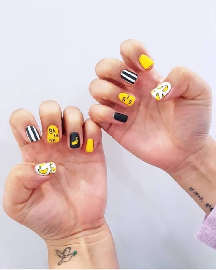 Bold banana-themed tips from Hana Nail. 