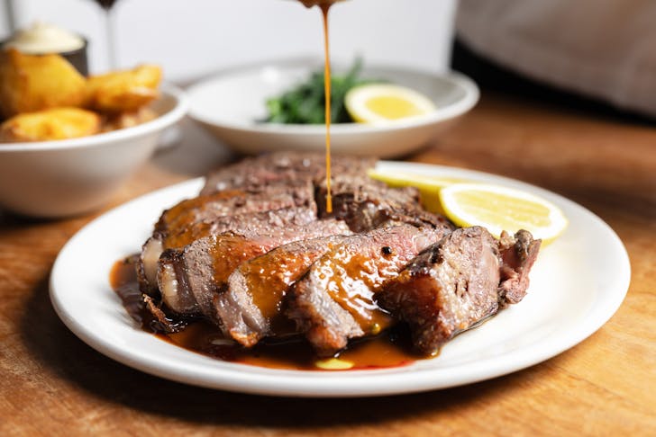 Beef dish on table.