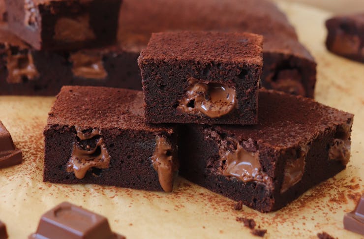Squares of brownie with melted Hazella chocolate pieces
