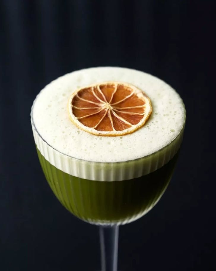 A green matcha yuzu cocktail.