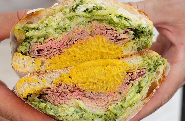 A photo of a Hector's Deli South Melbourne sandwich with mustard and roast beef