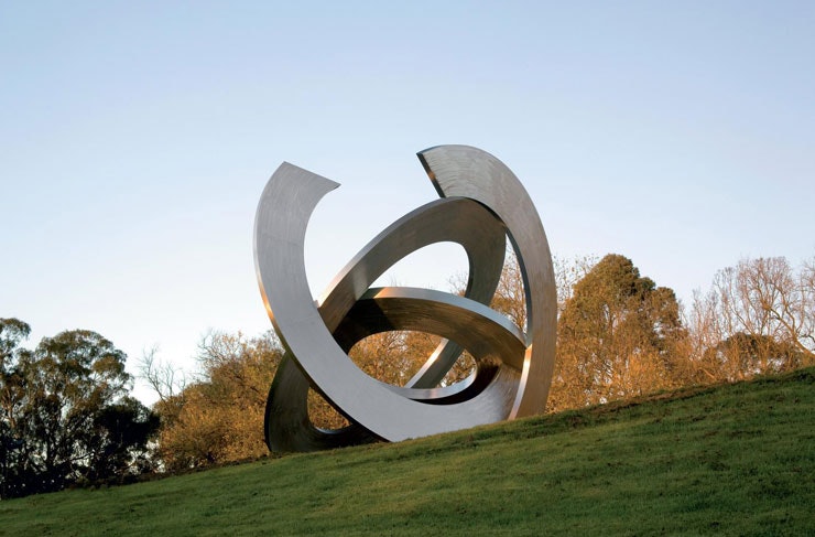 A metal outdoor sculpture on the gardens of an art gallery Melbourne.