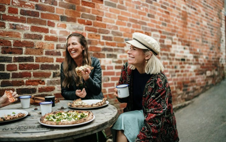 Friends eating their Pizza