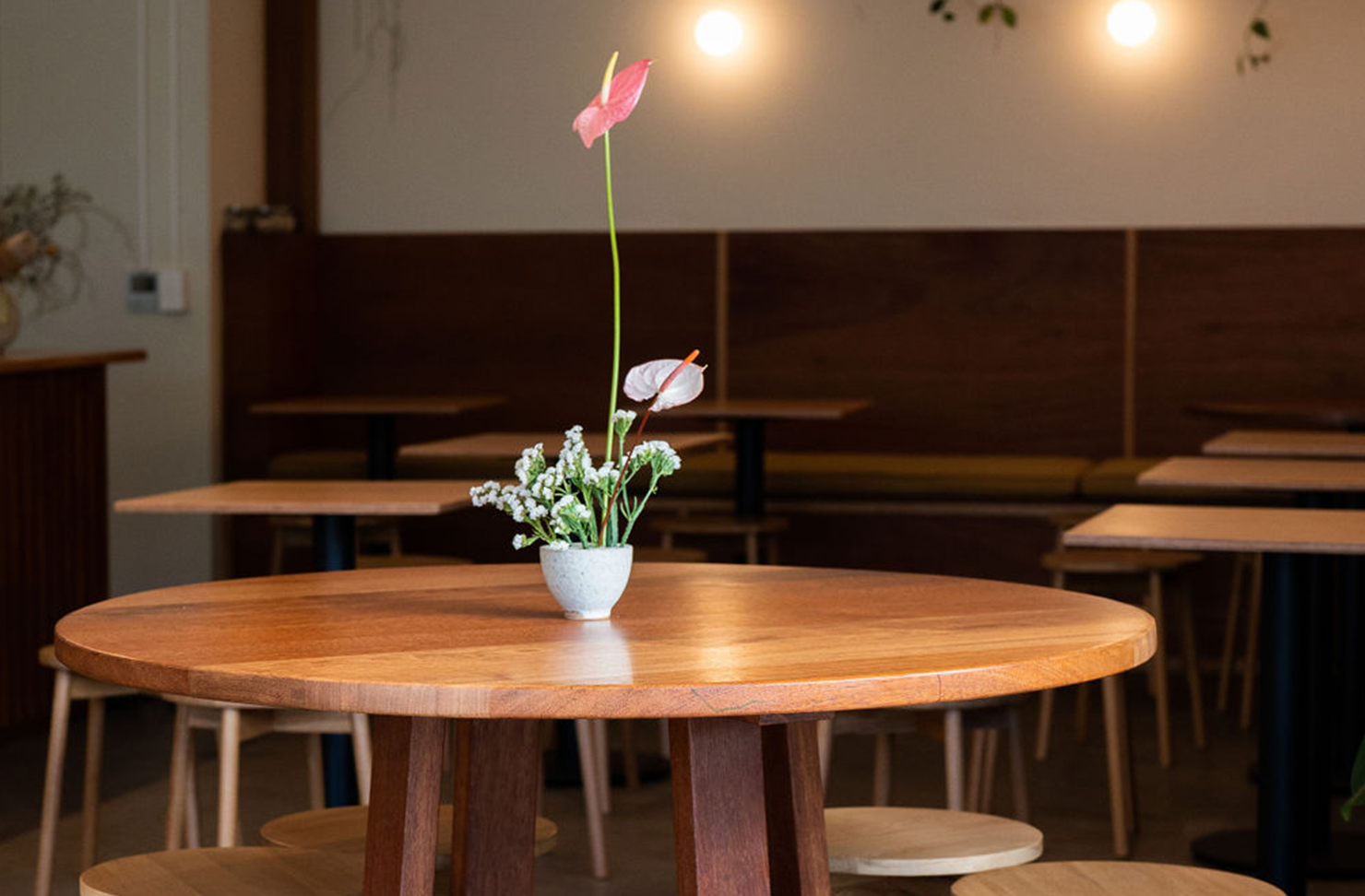 a mid-century cafe with wooden table