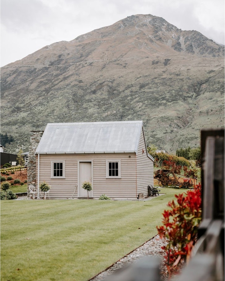 A view of the timber clad exterior of Hicks Cottage one of the best Queenstown accommodation options