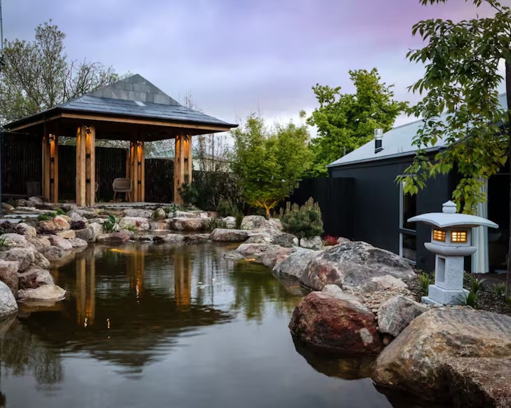 A view of the pond and pavilion at Hideyoshi Airbnb one of the best accommodation options in Daylesford