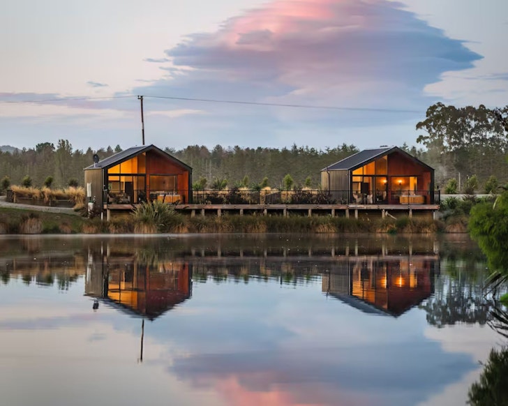 A view of HighTree Chalets on the water's edge. They are among the best cabin stays in New Zealand