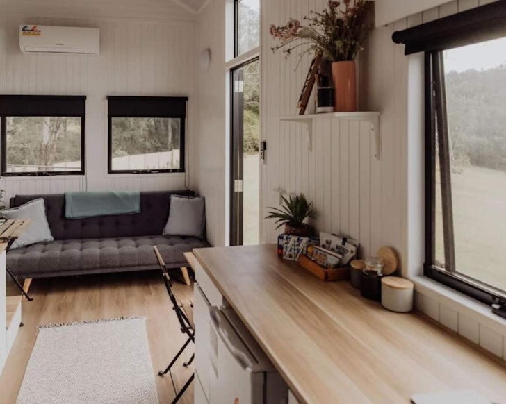 The couch and breakfast bar at Hill Creek tiny home South East Queensland