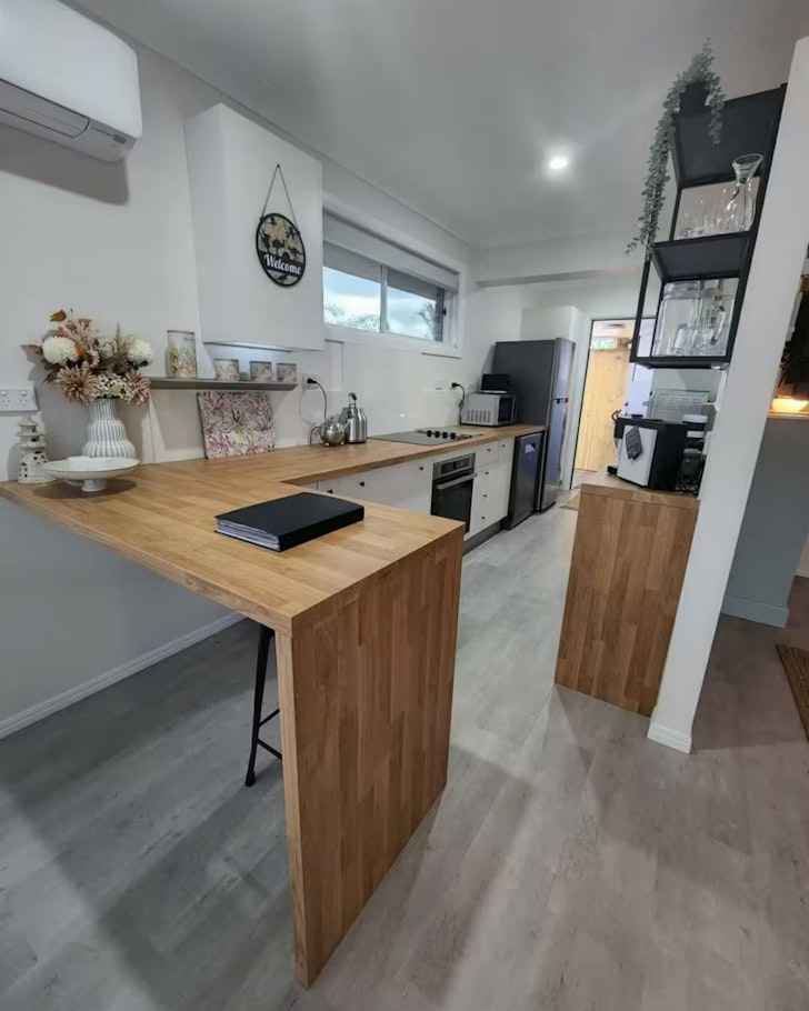 The kitchen is seen at Hilltop Haven Airbnb one of the best cheap accommodation options Brisbane
