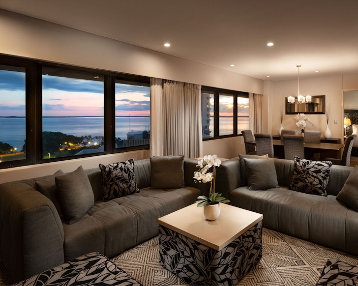 A suite in earthy tones with a sea view at Hilton Darwin one of the best Darwin hotels