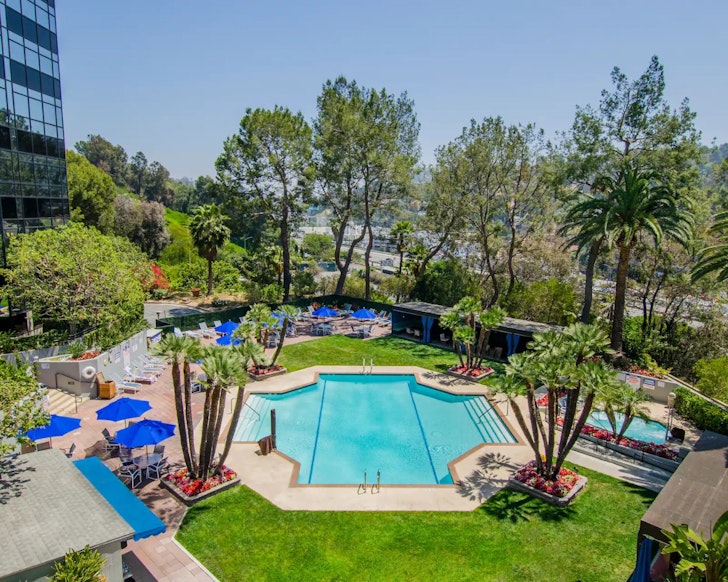 A view of the pool at Hilton Los Angeles-Universal City one of the best hotels for families Los Angeles