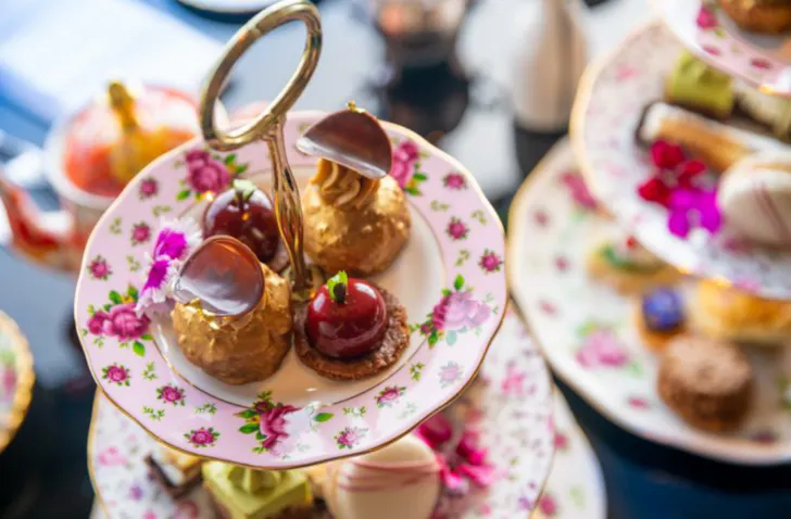 A beautiful selection of savoury and sweets on a high tea tray