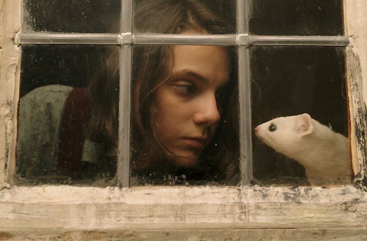 Dafne Keen as Lyra and her Daemon, Pan the mouse in HBO/BBC's His Dark Materials