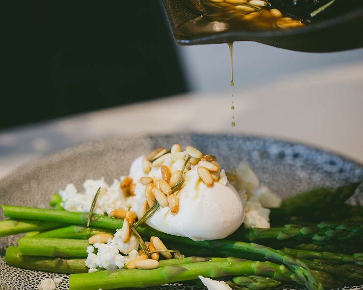 An egg, asparagus and pine nut dish at Homeland.