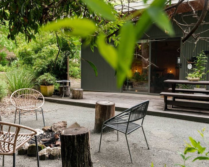 The patio with fire pit at Homeostasis Retreats Wellness Cabin Gold Coast