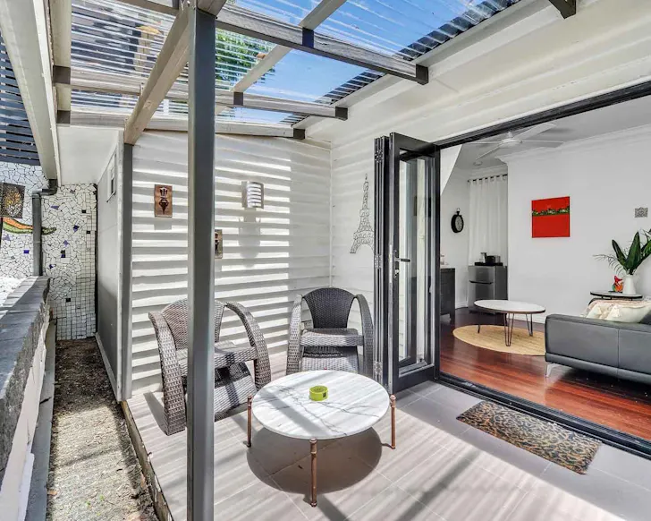 A view of the living space and outdoor zone at Homey Private Pad pet-friendly Airbnb Brisbane