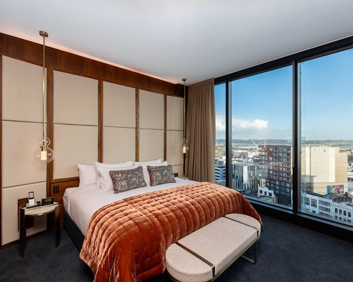 A plush, luxe bedroom at Horizon By SkyCity, one of the best hotels in Auckland. 