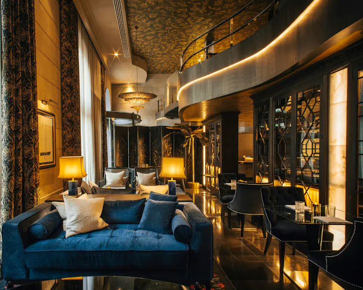 The slick jewel-toned lounge area of Hotel Bagues in Barcelona. 