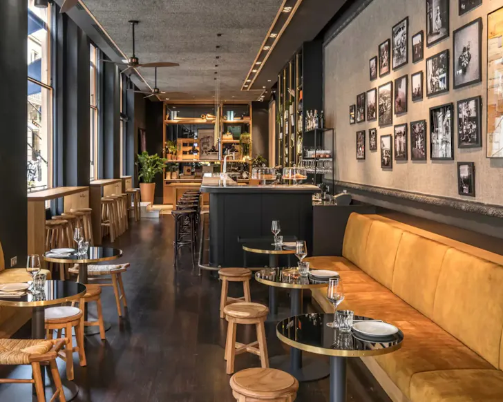 The modern, inviting library-turned-dining area at Hotel Casa Sagnier in Barcelona.