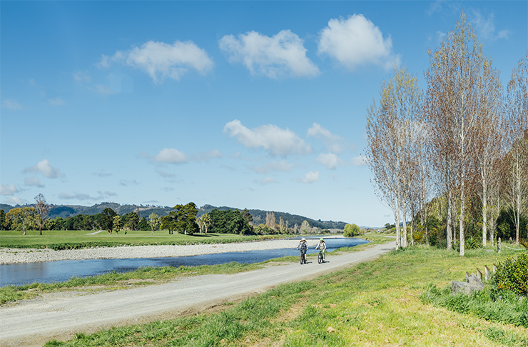 The Hutt River Trail with two people cycling in pure idyllic weather.