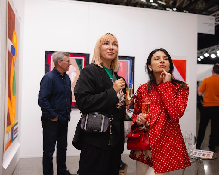 People peruse Aotearoa Art Fair 2024.